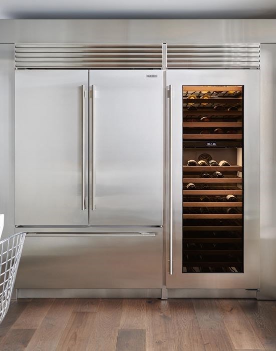 Sub-Zero 48" Classic French Door Refrigerator Freezer shown in a timeless European kitchen design displaying a Sub-Zero 30" Classic Wine Storage featuring 146-bottle capacity.