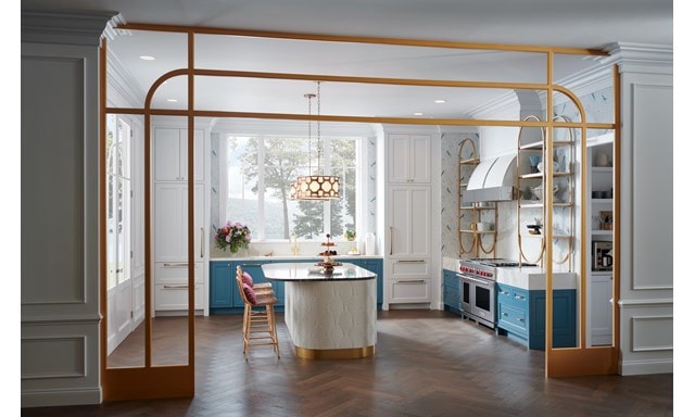 Wolf Appliances featured in a whimsical custom kitchen design showcasing open shelves, gold fixtures and white marble countertops