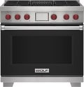 Wolf 36" 4 Burner Dual Fuel Range with Infrared Charbroiler (DF36450C/BK/P) featuring black accent colored door and signature red Wolf knobs.