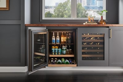 Three shelves stacked with an assortment of drinks in Sub-Zero 24" Designer Undercounter ADA Height Beverage Center - Panel Ready (DEU2450BG/ADA)