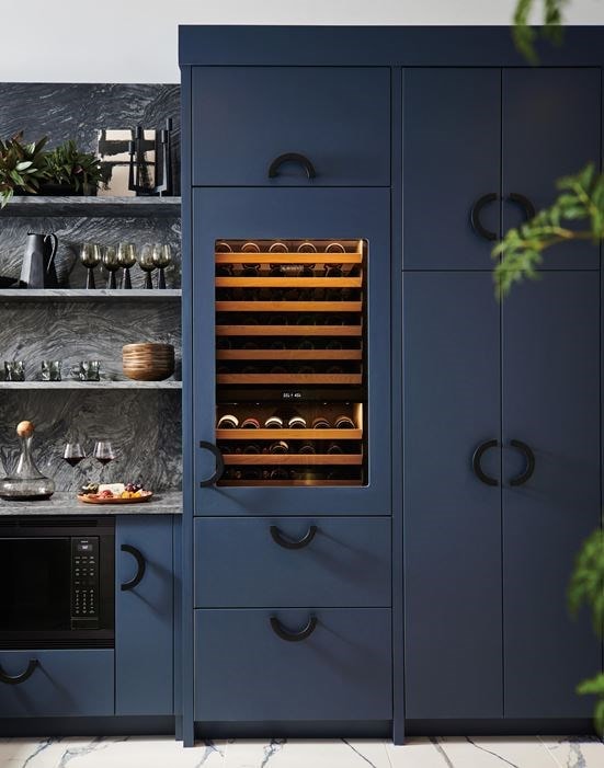 Sub-Zero 30 Inch Wine Column for High Altitude shown set flush within a custom midnight blue butler's pantry outfitted with rod iron handles