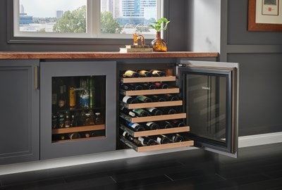 Sub-Zero 24" Designer Undercounter ADA Height Wine Storage - Panel Ready (DEU2450W/ADA) with wine racks extended at increasing lengths from top to bottom