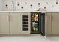 Four full shelves stacked with an assortment of drinks in Sub-Zero 15" Designer Undercounter Beverage Center - Panel Ready (DEU1550BG)
