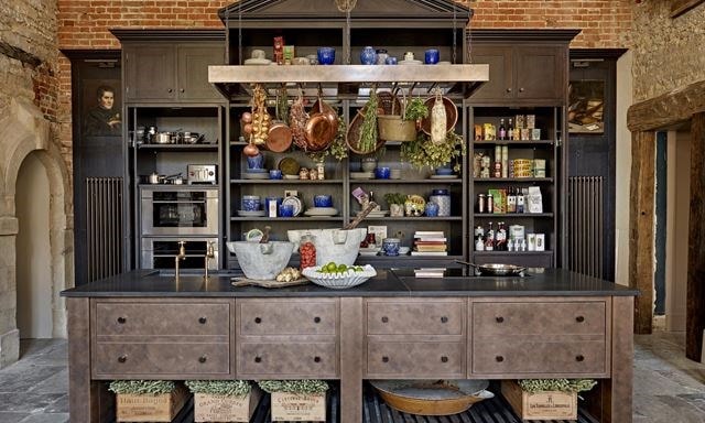 The centerpiece of Cotswold Stately Home by Naomi Peters is an impressive dresser inspired by a drawing of the original kitchen.