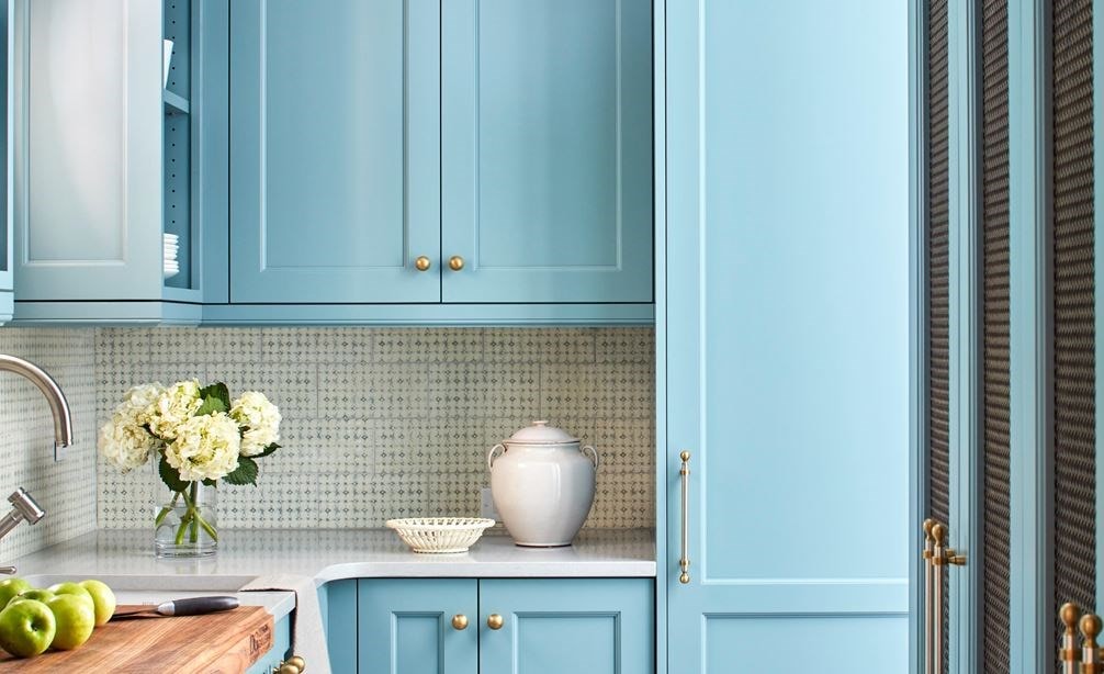 Blue painted cabinetry in Tradition with a Pinch of Panache by Matthew Quinn.