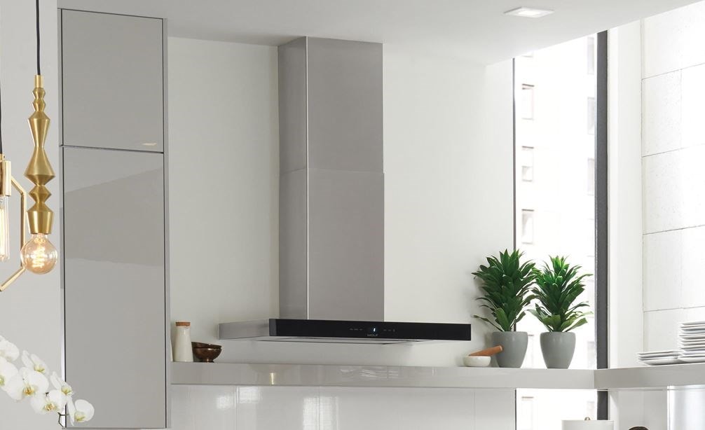 The Wolf 30&quot; Cooktop Wall Hood - Black (VW30B) featured in an open, fresh, light and functional modern kitchen design