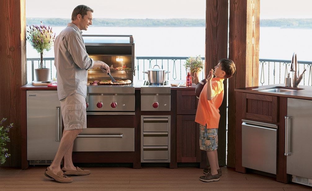 The Wolf 30&quot; Outdoor Warming Drawer (WWD30O) shown in a gourmet outdoor cooking area featuring best-in-class Wolf cooking appliances