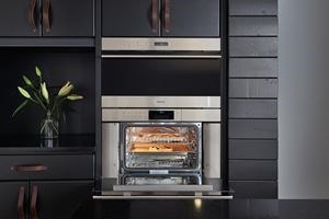 Use and care product demonstration featuring the Wolf Convection Steam Oven with Chef at Sub-Zero, Wolf and Cove Showroom