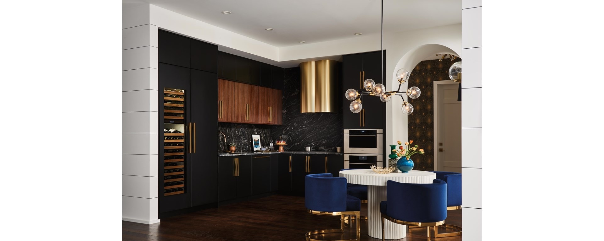 Modern high-rise custom kitchen design featuring Sub-Zero Designer Wine Storage, Wolf Contemporary Speed Oven and Cove Dishwasher