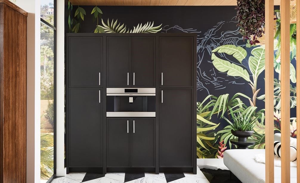 Wolf Built-In Coffee System shown installed seamlessly in black cabinetry