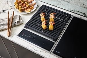 Wolf 15&quot; transitional grill module (GM15TFS) paired with a 15&quot; transitional induction cooktop module (CI152TFS)
