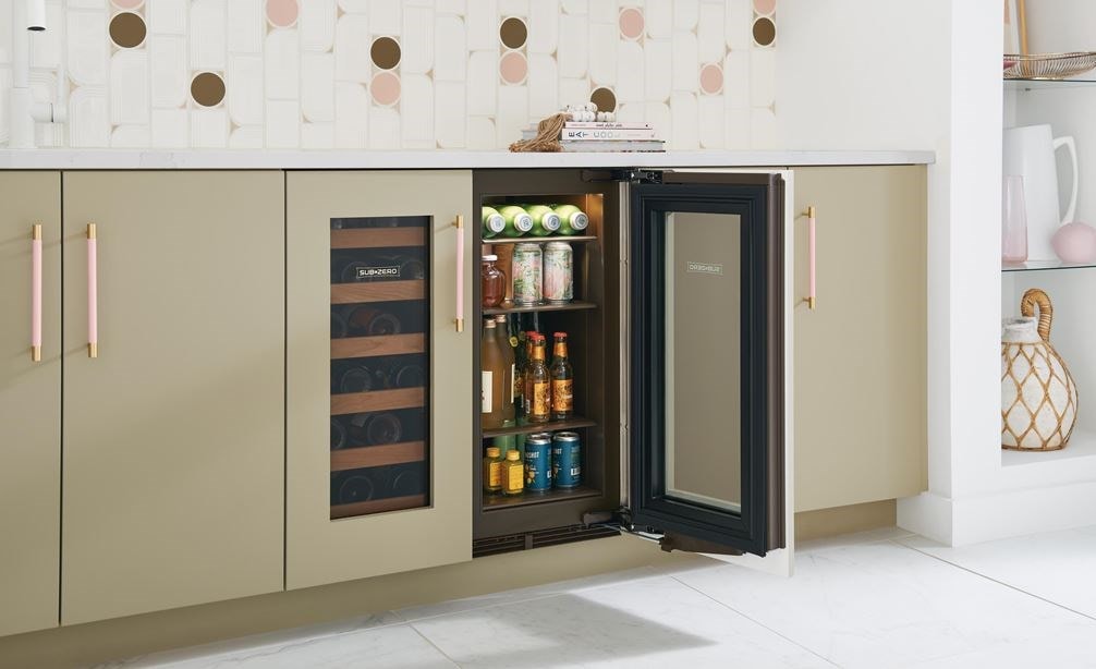 Side view of four full shelves stacked with an assortment of drinks in Sub-Zero 15" Designer Undercounter Beverage Center - Panel Ready (DEU1550BG) 