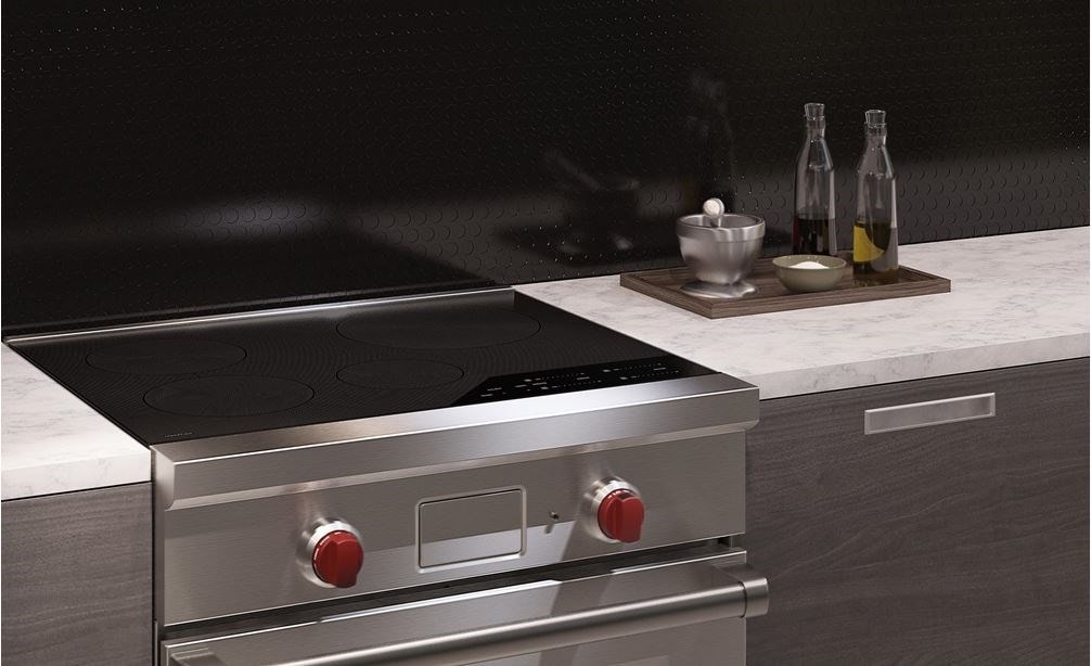 The Wolf 30&quot; Professional Induction Range (IR304PE/S/PH) shown with Wolf 30&quot; Pro Wall Hood - 24&quot; Depth (PW302418)