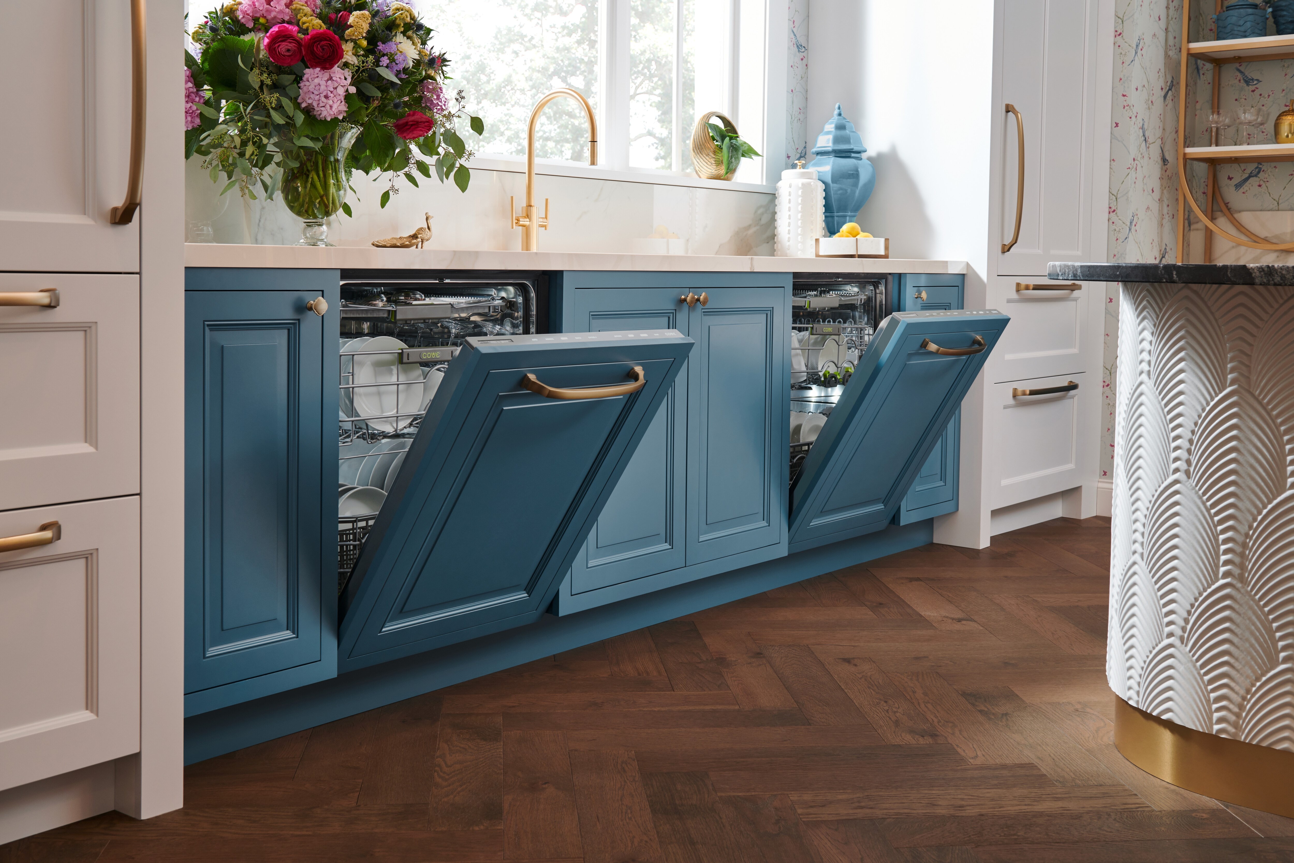 Dual 24 inch Panel Ready Dishwashers by Cove Dishwashers featuring cusomt panels matching soft blue kitchen cabinets.