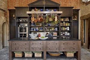 The centerpiece of Cotswold Stately Home by Naomi Peters is an impressive dresser inspired by a drawing of the original kitchen.