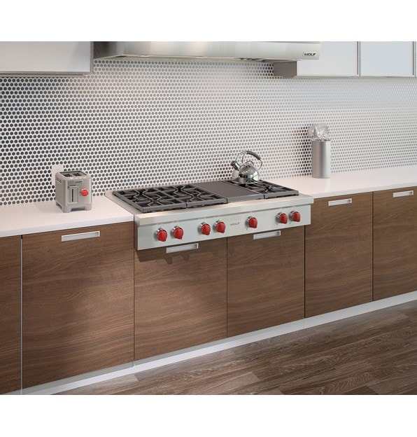 Wolf 48" Sealed 6 Burner Rangetop and Infrared Charbroiler (SRT486C) shown in a clean and sleek kitchen with streamlined surfaces