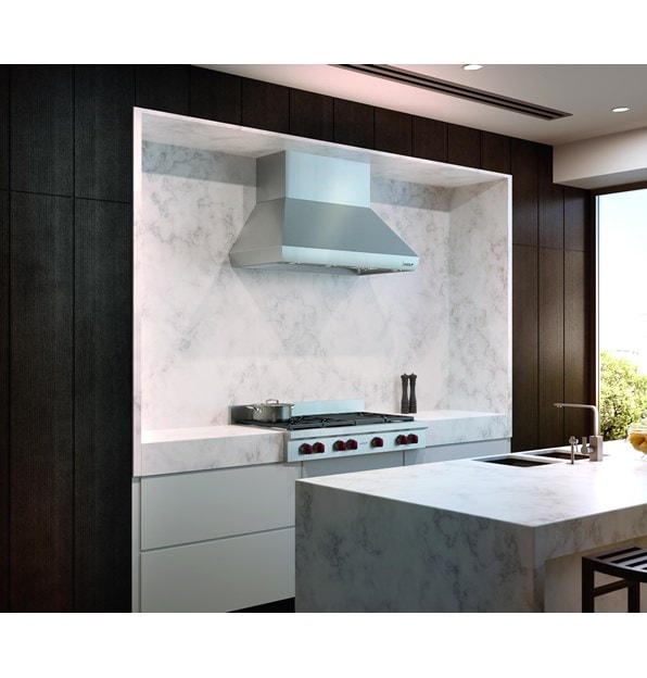 The Wolf 48" Sealed 6 Burner Rangetop and Infrared Charbroiler (SRT486C) shown centered in a custom natural stone veneer wall