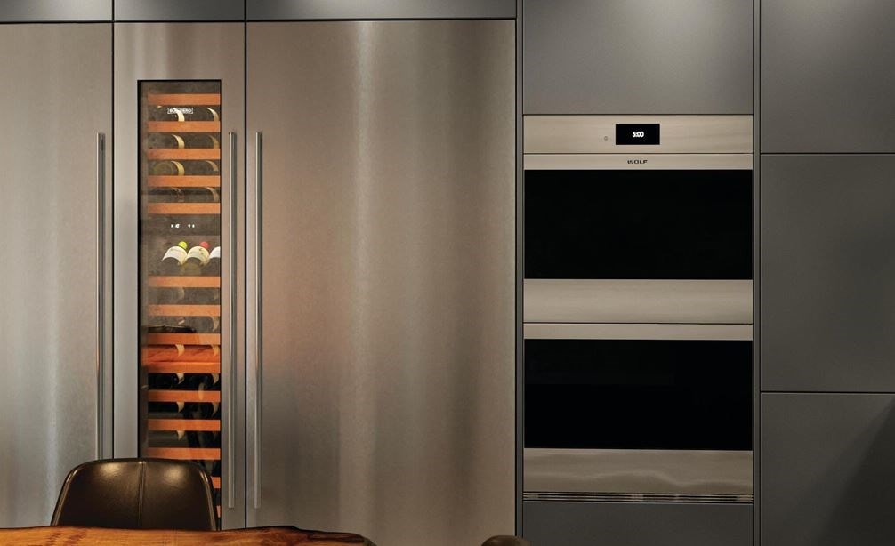 The Wolf 30&quot; M Series Contemporary Stainless Steel Double Oven (DO30CM/S) shown in a classic ultra modern European design kitchen style.