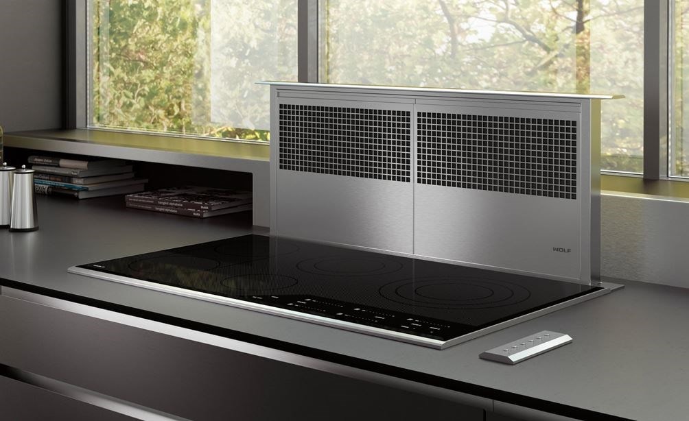 Wolf 36&quot; Downdraft Ventilation (DD36) shown with 36&quot; Contemporary Electric Cooktop (CE365C/B) in a luxurious modern kitchen