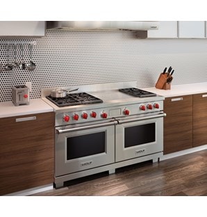 The Wolf 60" Dual Fuel Range 6 Burner French Top (DF606F) shown with Wolf Two-Slice-Toaster with Red Knob (WGTR102S)
