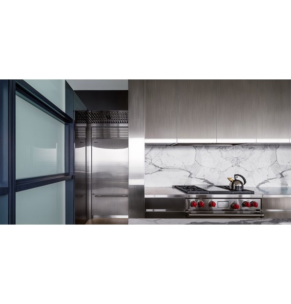 The Wolf 36" Dual Fuel Range 4 Burner Infrared Griddle (DF364G) paired with Sub-Zero 36" Classic Over Under Refrigerator Freezer (BI-36U/S)