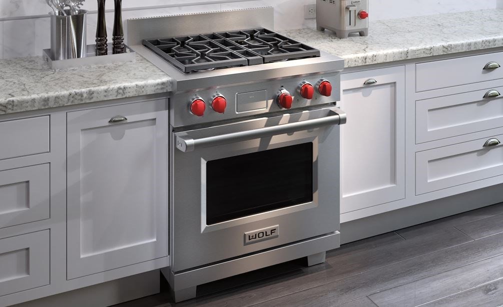 The Wolf 30&quot; Dual Fuel Range 4 Burner (DF304) Cooktop displayed in a clean modern contemporary kitchen design.