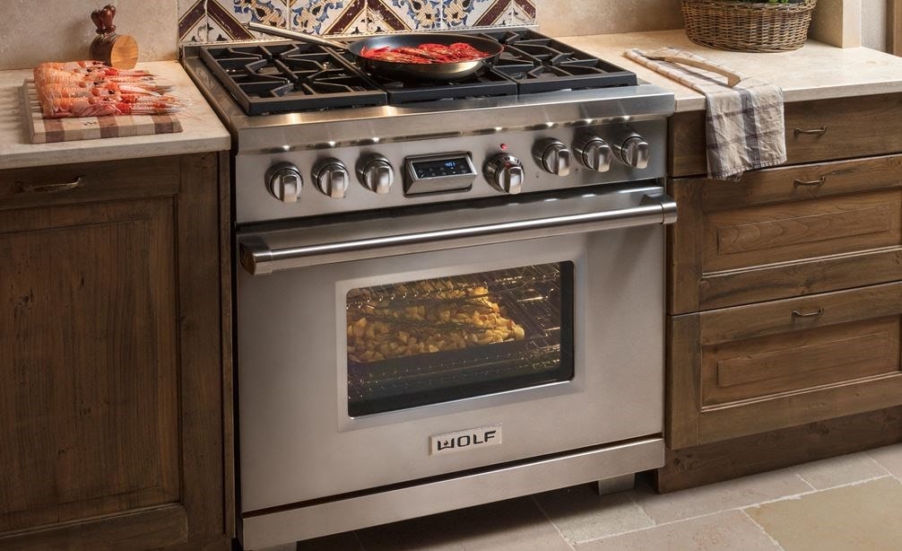 The Wolf 36&quot; Dual Fuel Range 6 Burner (DF366) Cooktop shown blending seamlessly in a rustic modern kitchen design.