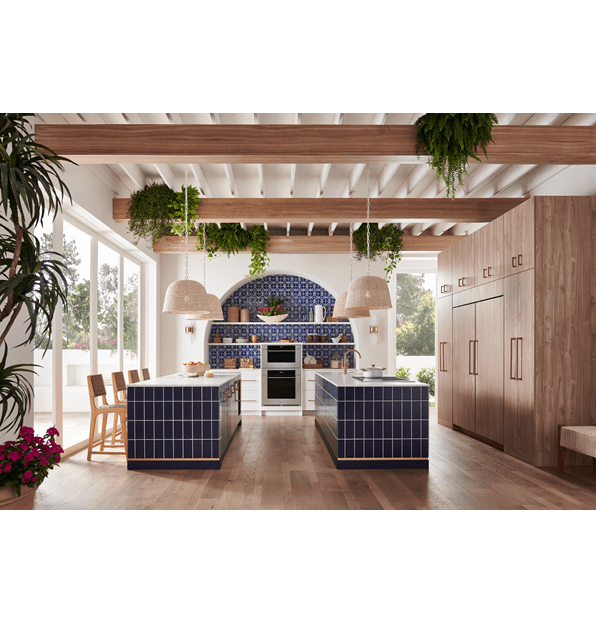 Wolf 30 Inch M Series Transitional Convection Steam Oven displayed in a Mediterranean kitchen design featuring double island, custom blue tile backsplash and exposed wood beam ceiling 