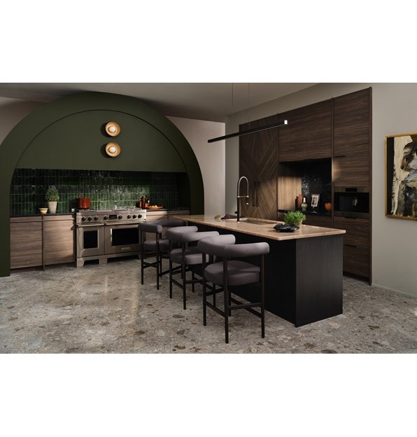 Wolf 24 Inch E Series Transitional Coffee System shown centered in a large forest green arched kitchen design with custom racing green backsplash and custom handleless wood cabinetry