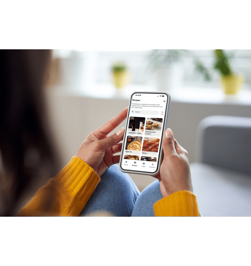 A woman viewing recipes on the Sub-Zero Group Owner's App to use with her luxury Sub-Zero, Wolf, and Cove appliances.