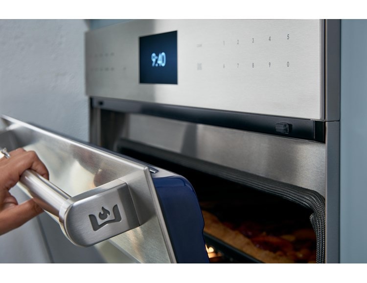 Chef product demonstration with Wolf Dual Stacked Burners at Sub-Zero, Wolf and Cove Showroom in Atlanta, Georgia