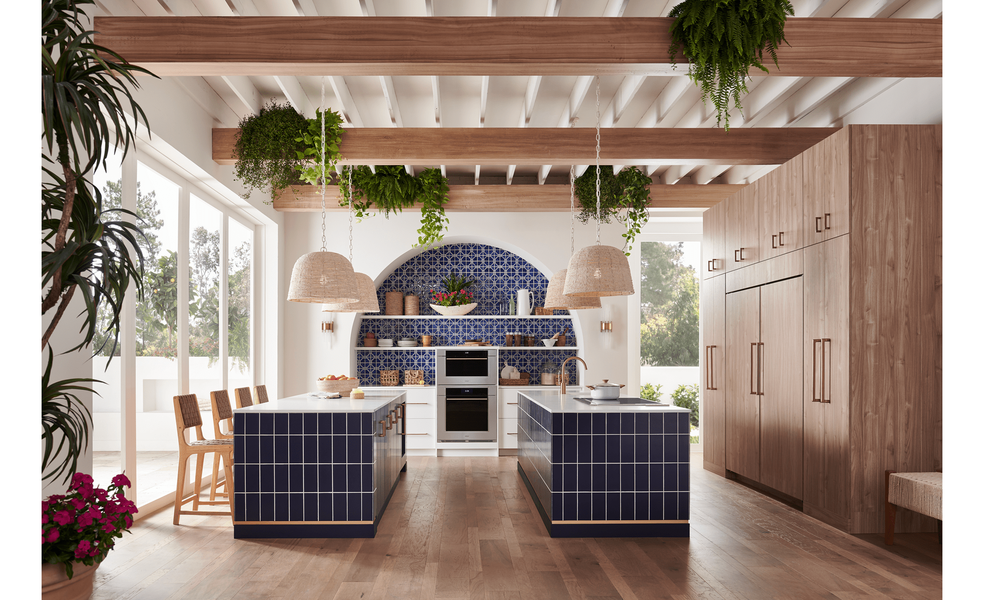 Wolf 30 Inch M Series Transitional Convection Steam Oven displayed in a Mediterranean kitchen design featuring double island, custom blue tile backsplash and exposed wood beam ceiling 
