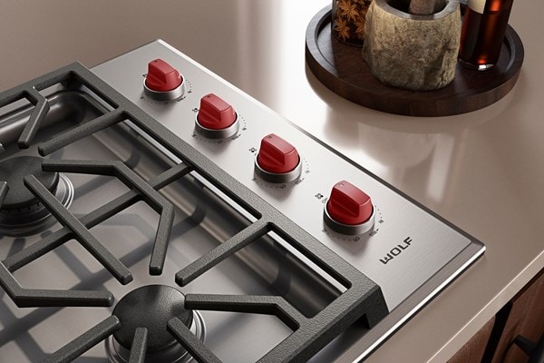 Wolf M Series 30" Gas Cooktop (Professional) shown with iconic red knobs