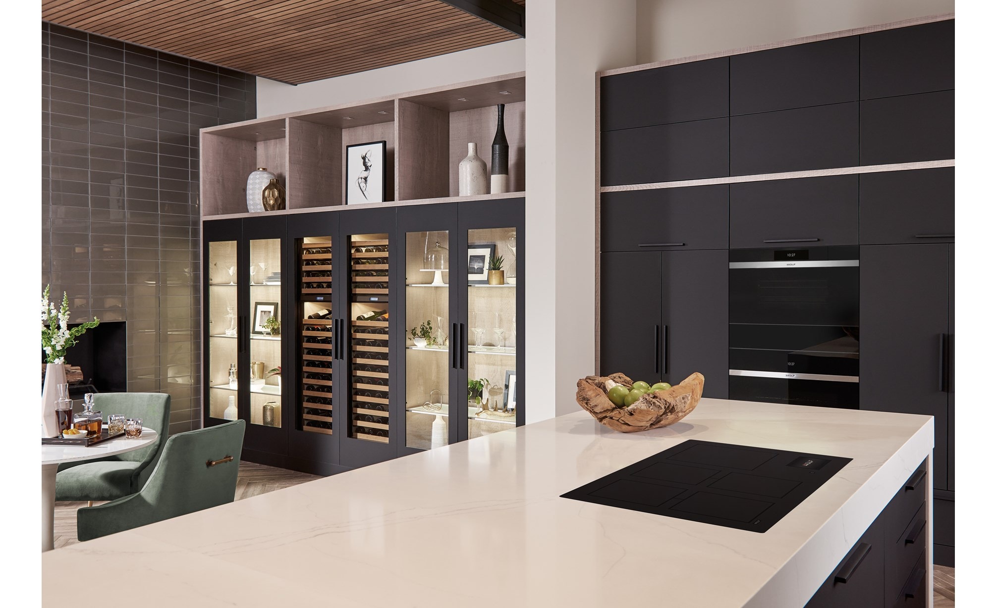 Wolf 36 Contemporary Induction Cooktop (CI36560C/B) featured in an open kitchen concept design with large white kitchen island and black kitchen cabinetry.