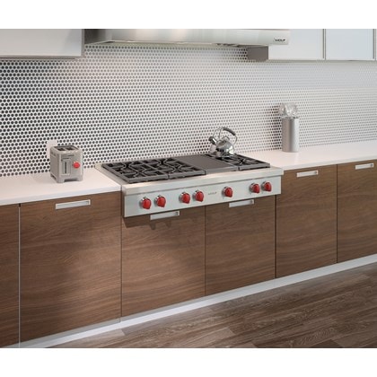 Wolf 48" Sealed 6 Burner Rangetop and Infrared Charbroiler (SRT486C) shown in a clean and sleek kitchen with streamlined surfaces