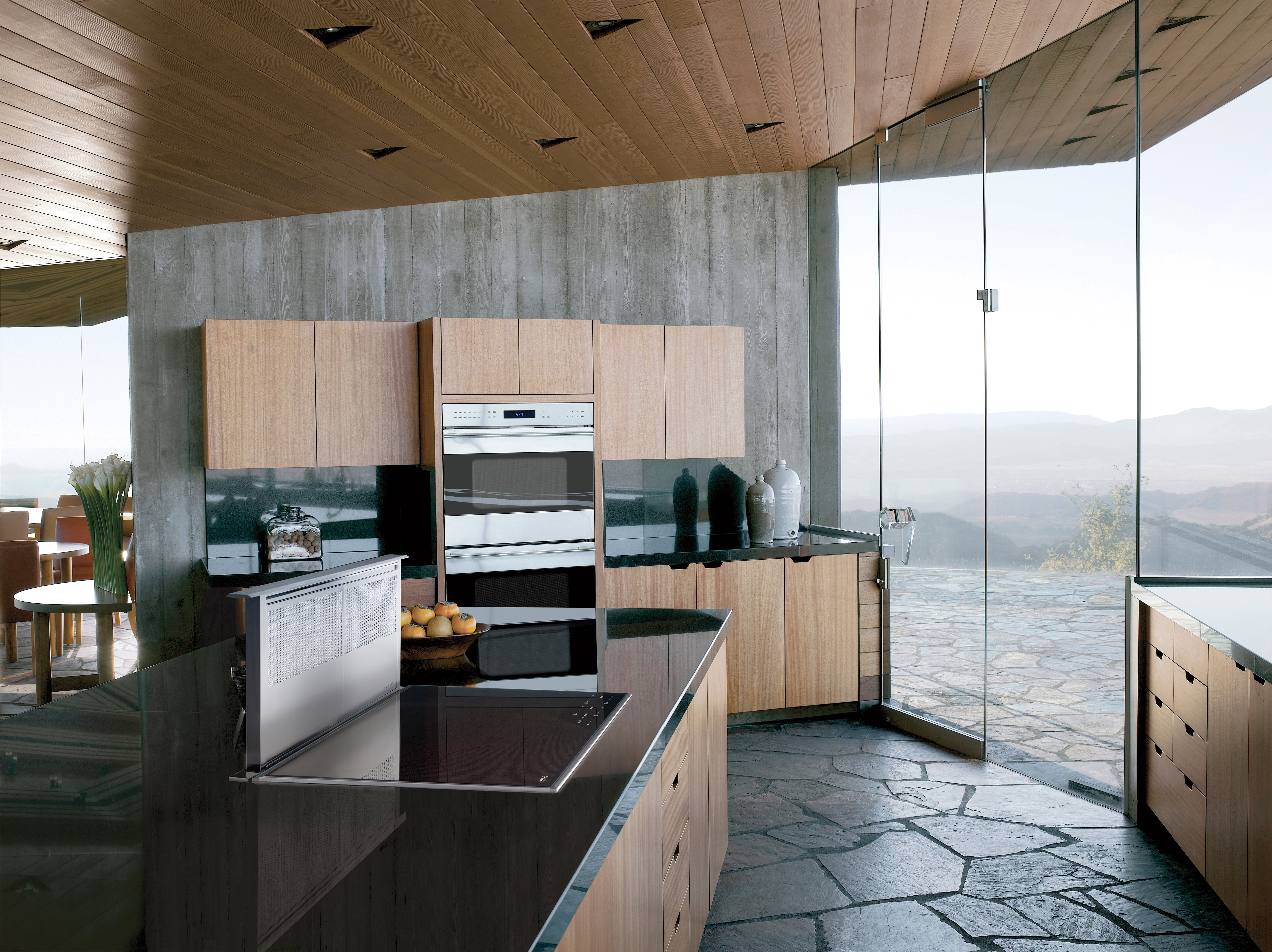 The Wolf 30" E Series Transitional Built-In Double Oven (DO30TE/S/TH) paired with a Wolf 36" Transitional Induction Cooktop (CI365T/S)