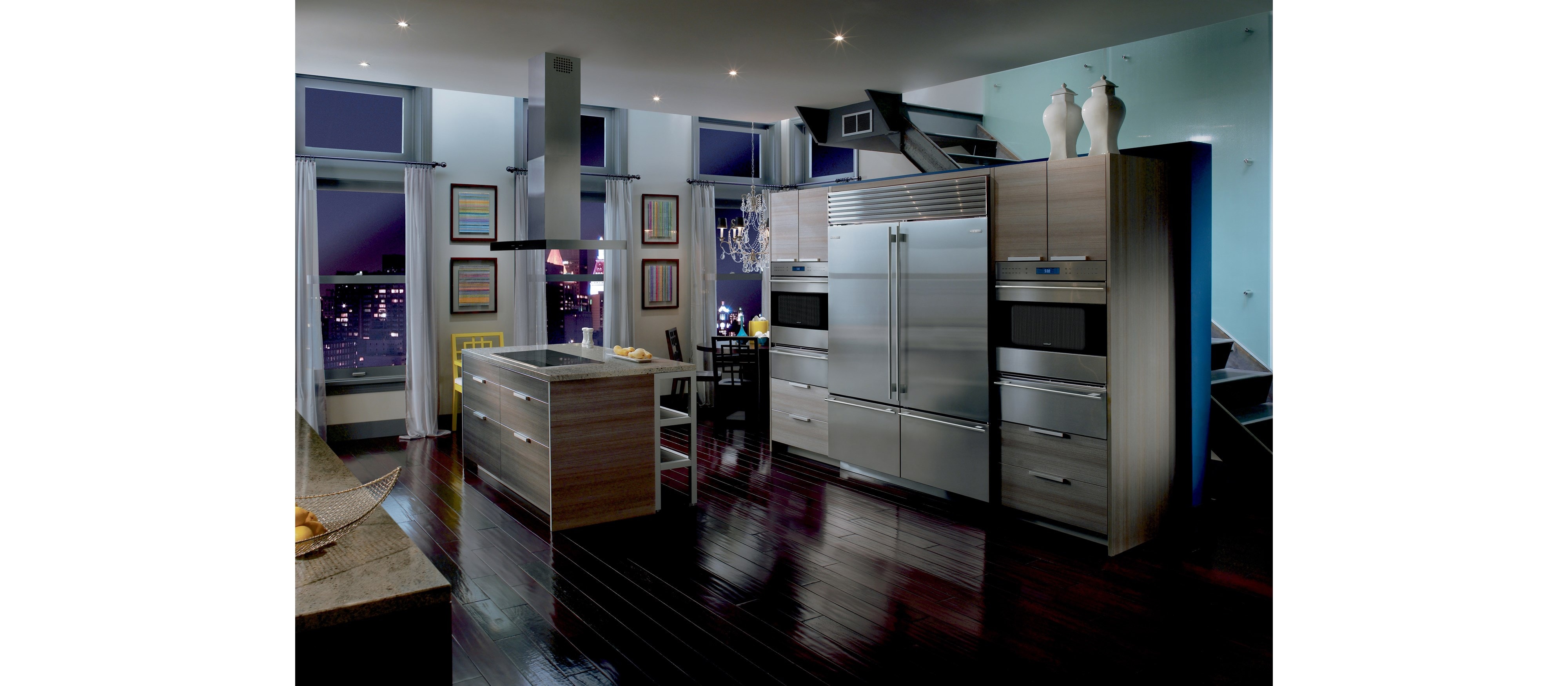 Pair of Wolf 30" E Series Transitional Classic Single Ovens (SO30TE/S/TH) on each side of Sub-Zero 30" Classic Over Under Refrigerator (BI-30U/S)