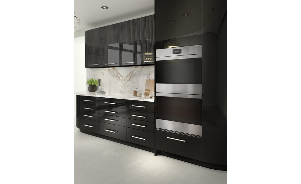 The Wolf 30" M Series Contemporary Stainless Steel Double Oven (DO30CM/S) shown blending seamlessly into modern glossy kitchen cabinetry.