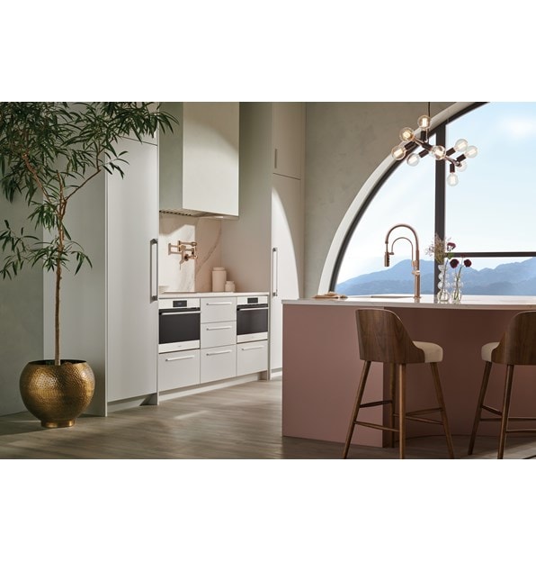 Wolf 24" E Series Transitional Convection Steam Oven (CSO2450TE/S/T) displayed in white custom cabinetry kitchen overlooking mountains