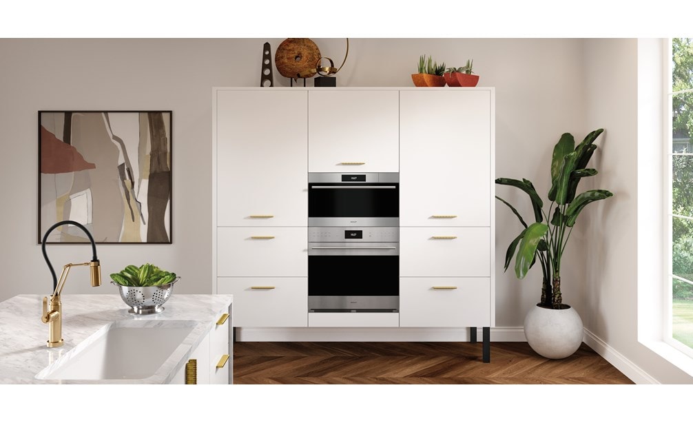 Wolf 30" E Series Transitional Convection Steam Oven (CSO3050TE/S/T) immersed in a sleek white French kitchen