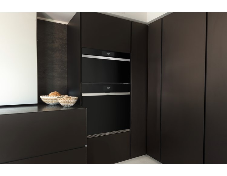 Wolf 30" M Series Contemporary Handleless Steam Oven (CSO3050CM/B) displayed in matte brown custom cabinetry