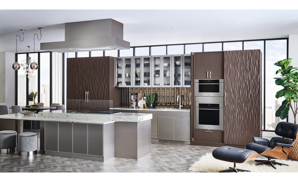 Wolf 30" M Series Transitional Convection Steam Oven (CSO3050TM/S/T) shown alongside wavy chocolate paneled cabinetry and white quartz countertops