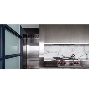 The Wolf 36" Dual Fuel Range 4 Burner Infrared Griddle (DF364G) paired with Sub-Zero 36" Classic Over Under Refrigerator Freezer (BI-36U/S)