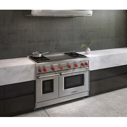 The Wolf 48" Gas Range 4 Burner Infrared Dual Griddle (GR484DG) Rangetop featured in a natural urban kitchen design