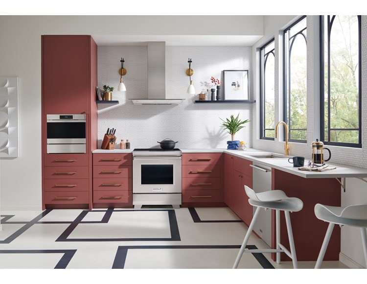 Wolf 30" Professional Induction Range (IR30450/S/P) featured in salmon cabinetry kitchen with geometric flooring.