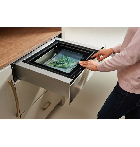 The Wolf 24" Vacuum Seal Drawer (VS24) adds the culinary tool professional chefs have enjoyed for years in any custom kitchen design