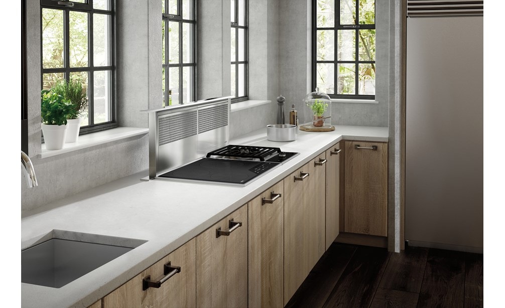 The Wolf 45" Downdraft Ventilation (DD45) featured in a bright and open kitchen design featuring natural wood cabinets and floors