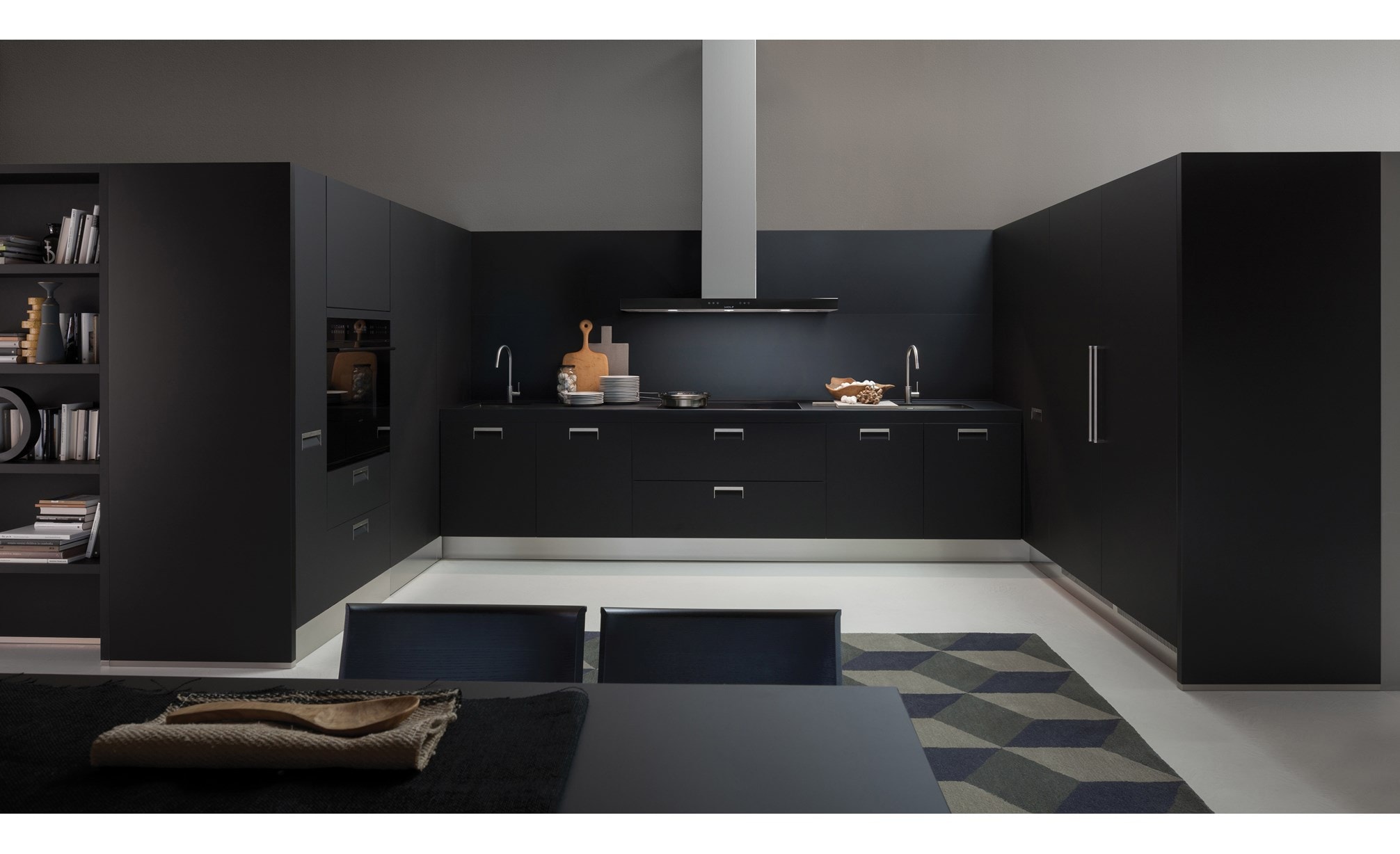 The Wolf 45" Cooktop Wall Hood - Black (VW45B) shown blending seamlessly into a sleek dark tone contemporary room design.