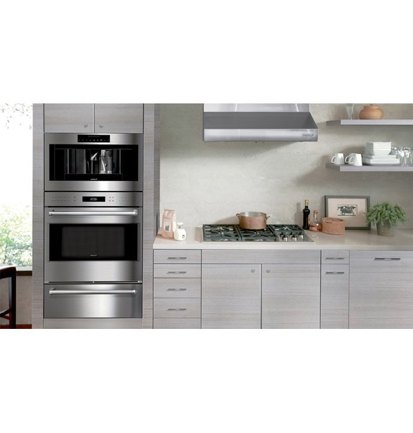 Wolf 30" Low Profile Wall Hood (PW302210) shown in clean, compact and powerful kitchen design featuring best-in-quality Wolf appliances