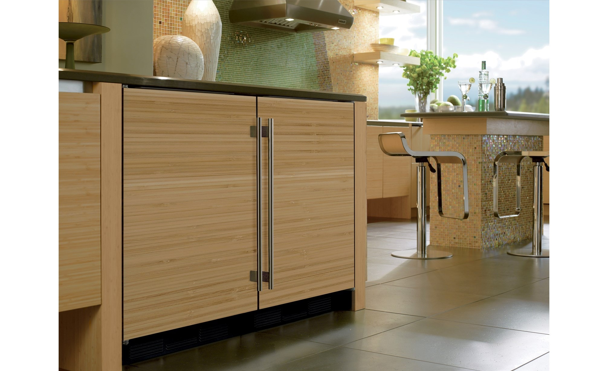 The Sub-Zero 24" Undercounter Refrigerator Freezer Panel Ready (UC- 24R) featuring custom solid wood panel with stainless steel handle.